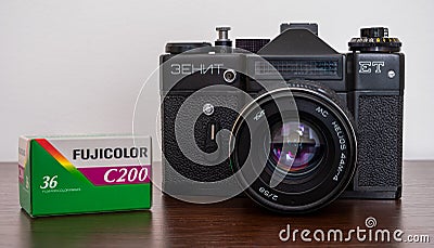 Soviet analog film camera Zenit ET, with a pack of Fujifilm Fujicolor C200 film Editorial Stock Photo