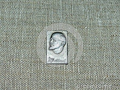 Soviet badge depicting Vladimir Ilyich Lenin with the inscription in Russian `V. Ulyanov` from the collections Editorial Stock Photo