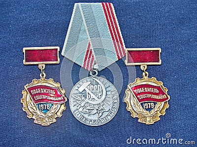 Soviet medal `Veteran of labor` and signs `Winner of the socialist competition`. Awarded to employees for conscientious work Stock Photo