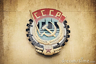 Soviet union CCCP emblem with hammer and sickle on a wall Stock Photo