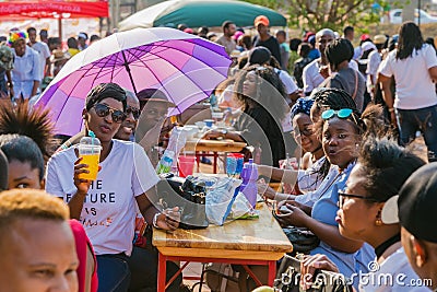 Diverse African people at a bread based street food outdoor festival Editorial Stock Photo