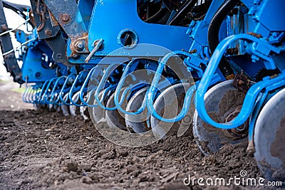 Sowing campaign in the field in early spring. Tractor with seeder Stock Photo