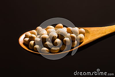 Soy beans on wood spoon Stock Photo