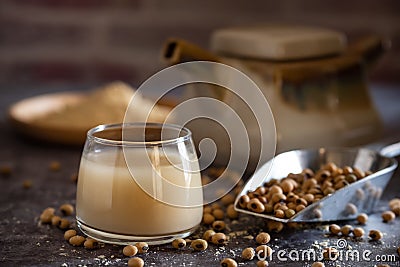 Soymilk in the glass and the kettle is placed beside. Stock Photo