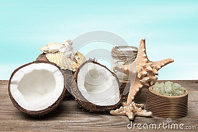 Spa coconut products and marine accessories on wooden boards, on turquoise background Stock Photo