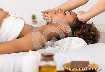 Spa concept. Afro woman getting professional face treatment Stock Photo