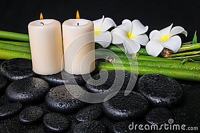 Spa concept of zen basalt stones, three white flower frangipani Stock Photo