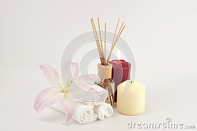 Spa decoration with candles, towels and aromatherapy oil bottle Stock Photo