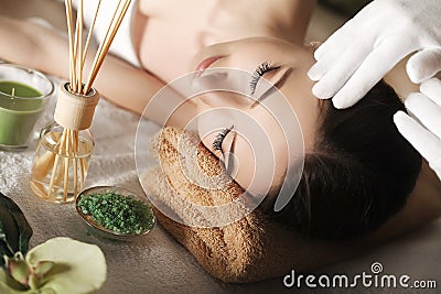 Spa. Face massage. Spa skin and body care. Close-up of young woman getting spa massage treatment at beauty spa salon. Facial beau Stock Photo