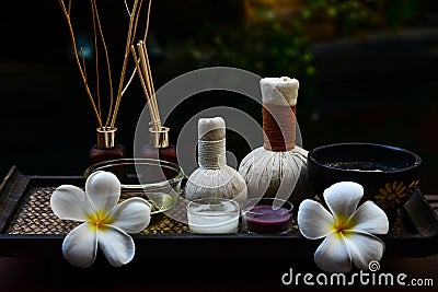 Spa feet and hand thai massage compress balls, herbal ball on the wooden with treatments spa , Stock Photo