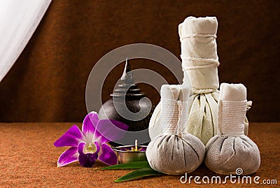 Spa herbal compressing ball with wooden casket and orchid. Stock Photo