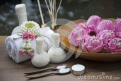 Spa massage compress balls, herbal ball with treaments spa and lotus , Thailand, soft focus Stock Photo