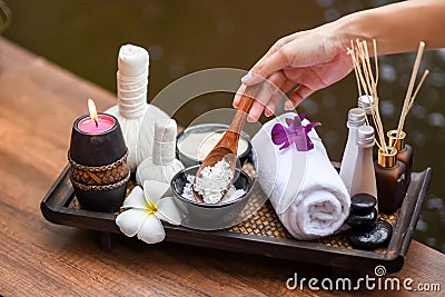 Spa massage compress balls, herbal ball on the wooden with treaments spa; Thailand, soft and select focus. Stock Photo