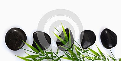 Spa massage stones and bamboo leaves Stock Photo