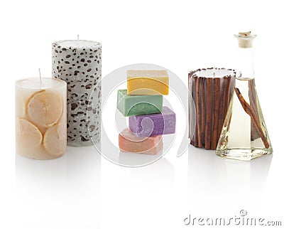 Spa oil in bottles with scented candles and soaps. Stock Photo