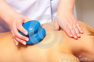 Spa salon. Woman relaxing having cupping-glass massage. Bodycare. Stock Photo