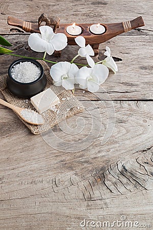 Spa sea salt and orchid on wood background , nature relaxation Stock Photo