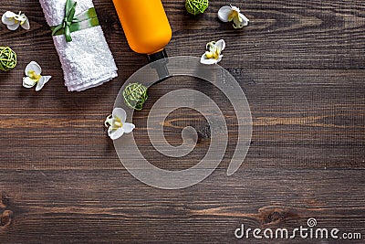 Spa set with cosmetics, flowers on wooden table background top view copyspace Stock Photo