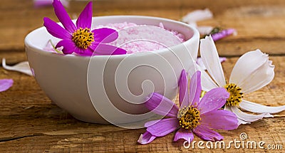 Spa setting with bath salt, floral bath salt bowl on wooden table, wellness and spa concept Stock Photo