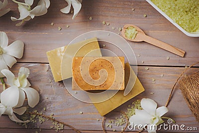 Spa setting with orchid, spoon,towel, soap, salt stones on old w Stock Photo