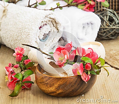 Spa Setting with Pink Beautiful Flowers and Sea Salt Stock Photo
