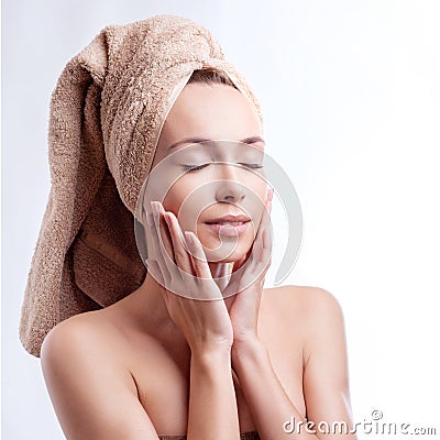 Spa skin care beauty woman wearing hair towel after beauty treatment. Beautiful multiracial young woman with perfect skin Stock Photo