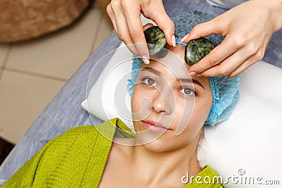 Spa treatment. Massage with jade stones Stock Photo