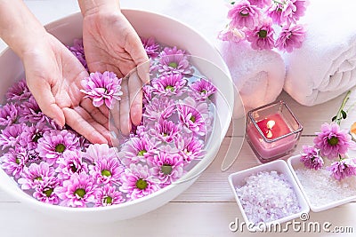 Spa treatment and product for female feet and manicure nails spa with pink flower and rock stone, copy space, select focus, Stock Photo