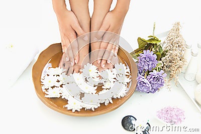 Spa treatment and product for hand and foot spa with flowers and water Stock Photo