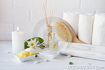 Spa treatment - towels aromatic soap, bath salt, and oil, and accessories for massage Stock Photo