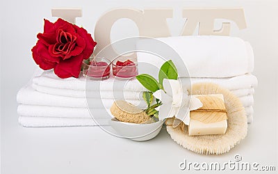 Spa wellness with red rose candles ,white towel ,milk soap and sea shell on white background Stock Photo