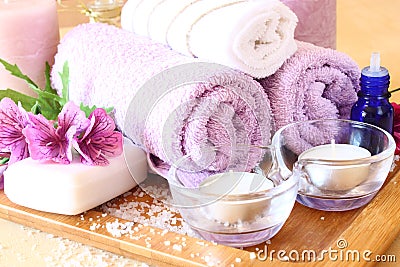 Spa and wellness setting with natural soap, candles and towel. natural wooden background Stock Photo