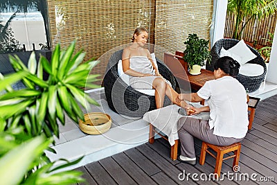 Spa Woman Body Care. Aromatherapy Leg Massage. Skincare Treatment Stock Photo