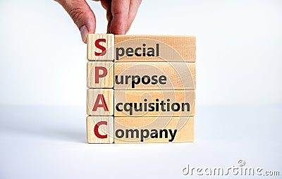 SPAC, special purpose acquisition company symbol. Businessman holds cubes with words `SPAC` on beautiful white background, copy Stock Photo