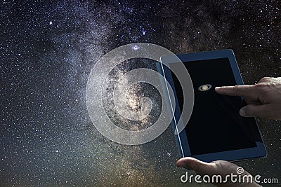 Space Astronomy Exploration Concept. Saturn planet tablet. Stock Photo