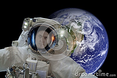 Space exploration. Astronaut in outer space. Planet earth from space on a dark background. Elements of this image were furnished Stock Photo