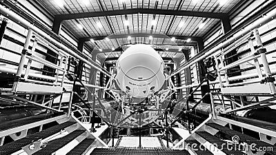 Space launch preparation. Spaceship SpaceX Crew Dragon, atop the Falcon 9 rocket, inside the hangar , just before Editorial Stock Photo