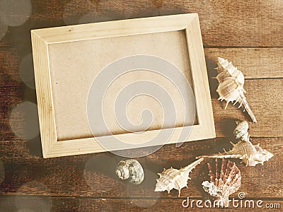 Photo frame with marine nautical decoration on wooden background Stock Photo