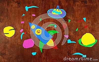 Space rocket and planets, solar system, Astronautics and space alien on wooden background-application made by child Stock Photo