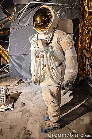 Space suit of Buzz Aldrin, born as Edwin Eugene Aldrin, exhibited next to a Full-sized replica of Eagle Editorial Stock Photo