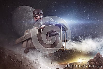 Space travel is huge business concept - businessman flying with toy plane Stock Photo