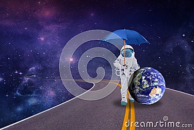 Space walk astronaut with a planet under an umbrella Stock Photo