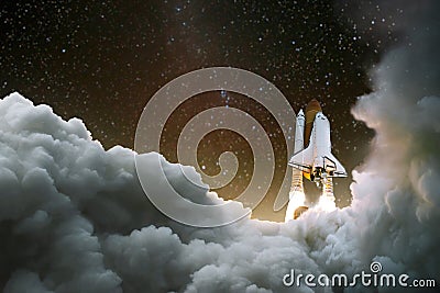Spacecraft takes off into space. Start of the journey. Space Exploration. Rocket with smoke on the starry sky Stock Photo
