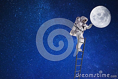 Spaceman on moon in outer space on leader Stock Photo