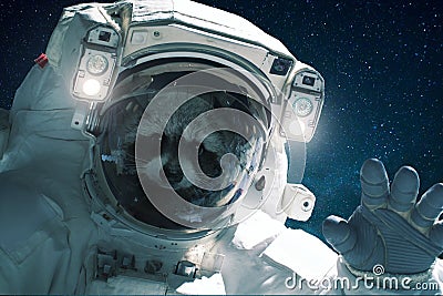 Spaceman raccoon in a spacesuit waves his hand. Animal in outer space, concept Stock Photo