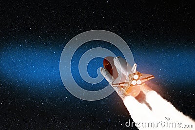 Spaceship lift off. Space shuttle with smoke and blast takes off into the starry sky. Rocket starts into space. Stock Photo