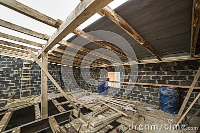 Spacious attic room under construction and renovation. Energy sa Stock Photo