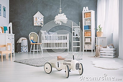 Spacious baby room with cot Stock Photo