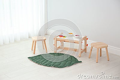 Spacious baby room with wooden furniture. Interior design Stock Photo