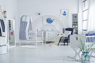 Spacious baby`s room with crib Stock Photo